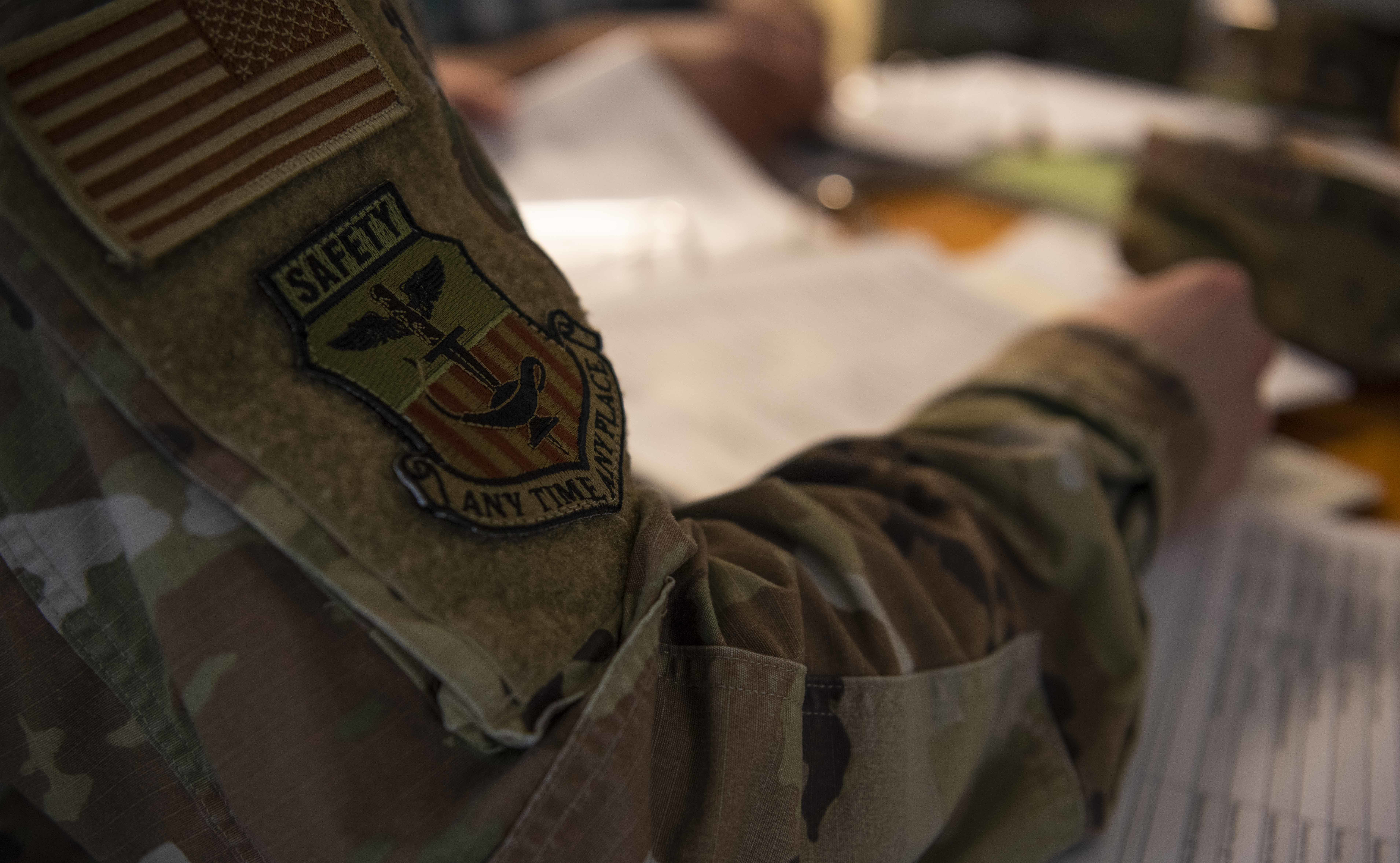 Military member reviewing checklist